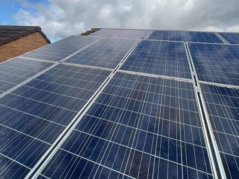 Rows of blue solar panels on a Sheffield roof after cleaning